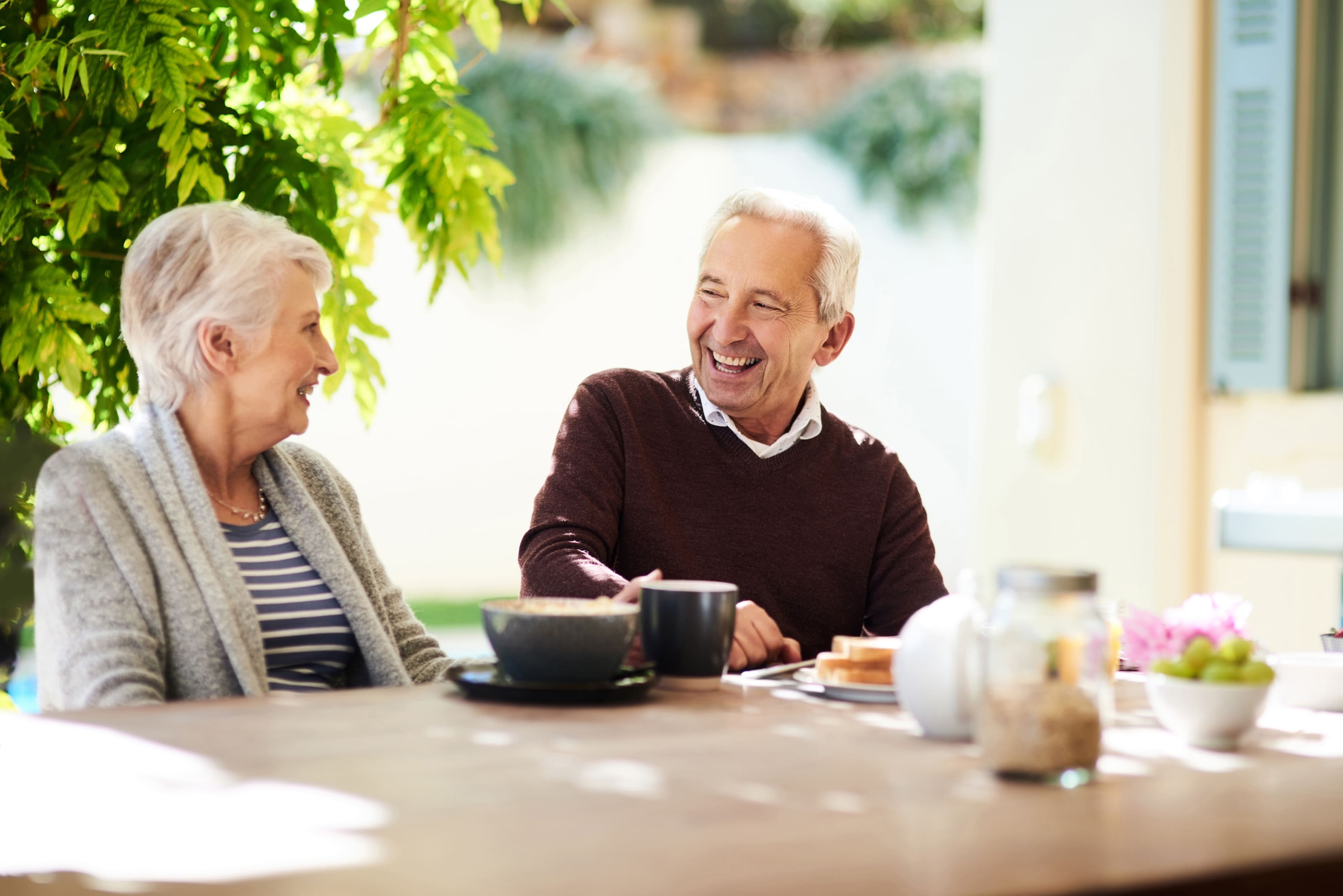 Senior couple enjoying coffee at a cafe